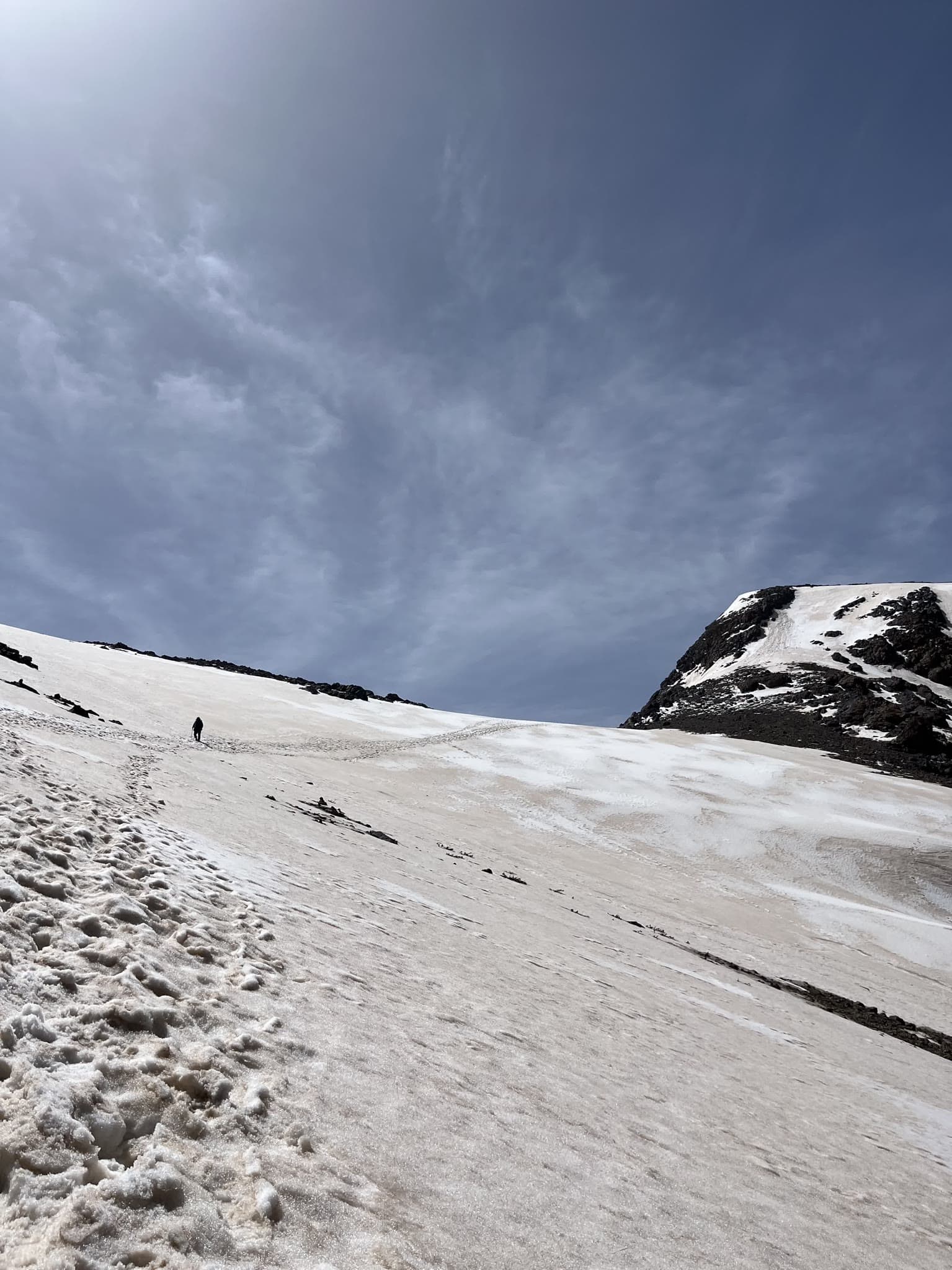 Climbing through a snowfield on Mount Halgurd