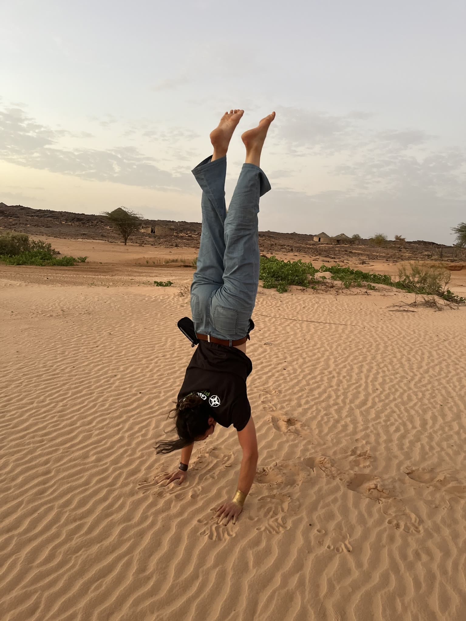 Handstand in the Mauritanian desert at sunset